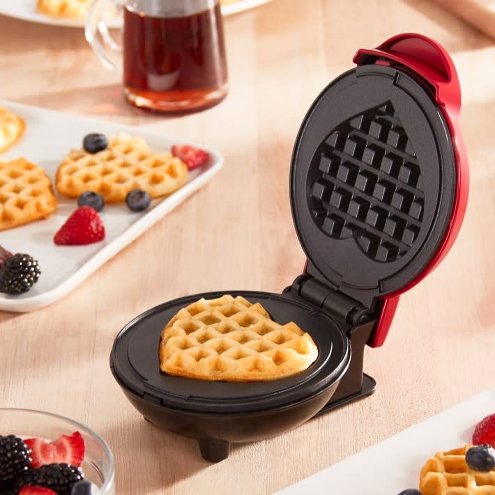 <p><a href="https://go.redirectingat.com?id=74968X1596630&url=https%3A%2F%2Fwww.williams-sonoma.com%2Fproducts%2Fdash-mini-heart-waffle-maker&sref=https%3A%2F%2Fwww.housebeautiful.com%2Fshopping%2Fg25741216%2Fbest-galentines-day-gifts%2F" rel="nofollow noopener" target="_blank" data-ylk="slk:Shop Now;elm:context_link;itc:0;sec:content-canvas" class="link rapid-noclick-resp">Shop Now</a></p><p>Dash Mini Heart Waffle Maker</p><p>williams-sonoma.com</p><p>$9.95</p>