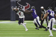 Houston Texans quarterback Deshaun Watson (4) is pressured by Baltimore Ravens defensive end Jihad Ward (53) during the first half of an NFL football game Sunday, Sept. 20, 2020, in Houston. (AP Photo/Eric Christian Smith)