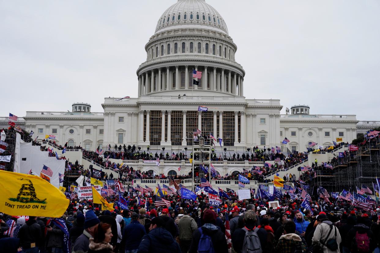 <p>Trump supporters storming the Capitol last Wednesday </p> (EPA)