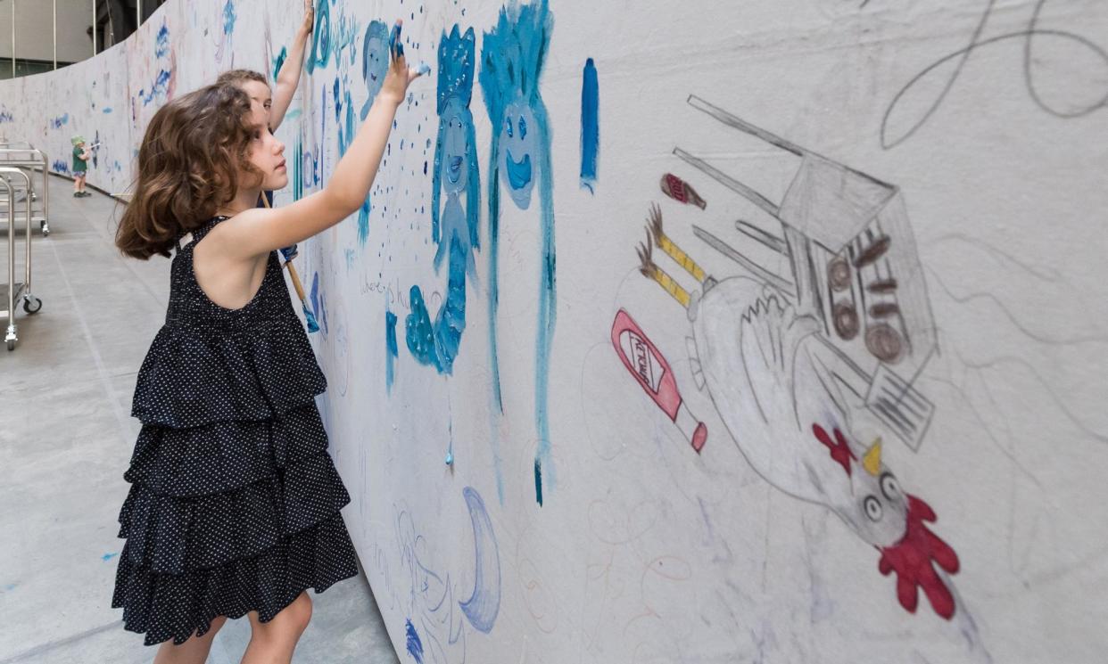 <span>A fun day out for free at Tate Modern, London adding to a giant, layered painting.</span><span>Photograph: Anadolu/Getty Images</span>