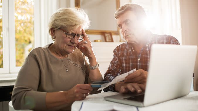 Senior couple paying their bills.