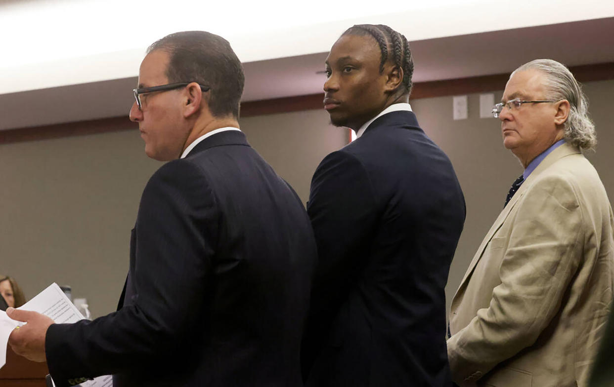 Former Las Vegas Raiders player Henry Ruggs, middle, appears in court with his attorneys Michael Schonfeld, left, and David Chesnoff at the Regional Justice Center in Las Vegas on Wednesday, May 10, 2023. Ruggs pleaded guilty to a felony count of DUI resulting in death and a misdemeanor charge of vehicular manslaughter in the death of 23-year-old Tina Tintor. (K.M. Cannon/Las Vegas Review-Journal/Tribune News Service via Getty Images)