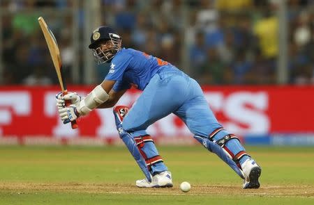 Cricket - West Indies v India - World Twenty20 cricket tournament semi-final - Mumbai, India - 31/03/2016. India's Ajinkya Rahane plays a shot. REUTERS/Danish Siddiqui