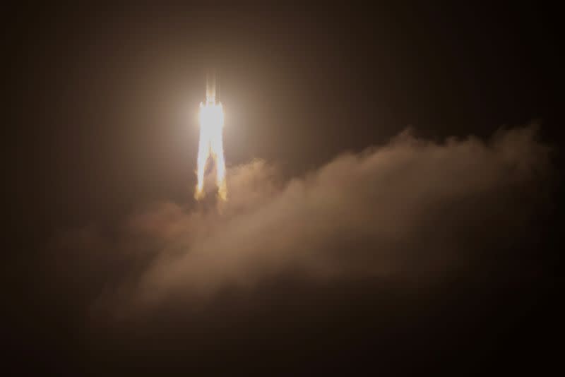 FILE PHOTO: The Long March-5 Y5 rocket, carrying the Chang'e-5 lunar probe, takes off from Wenchang Space Launch Center