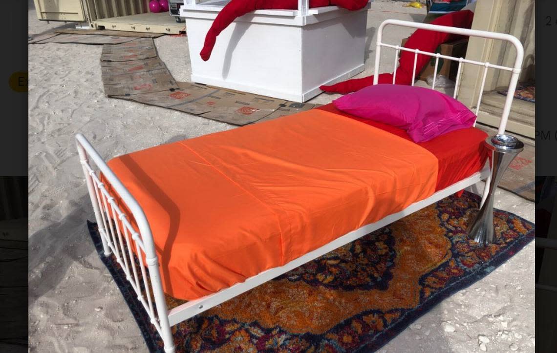 Bed on sand at Satellite art show in Indian Park Beach