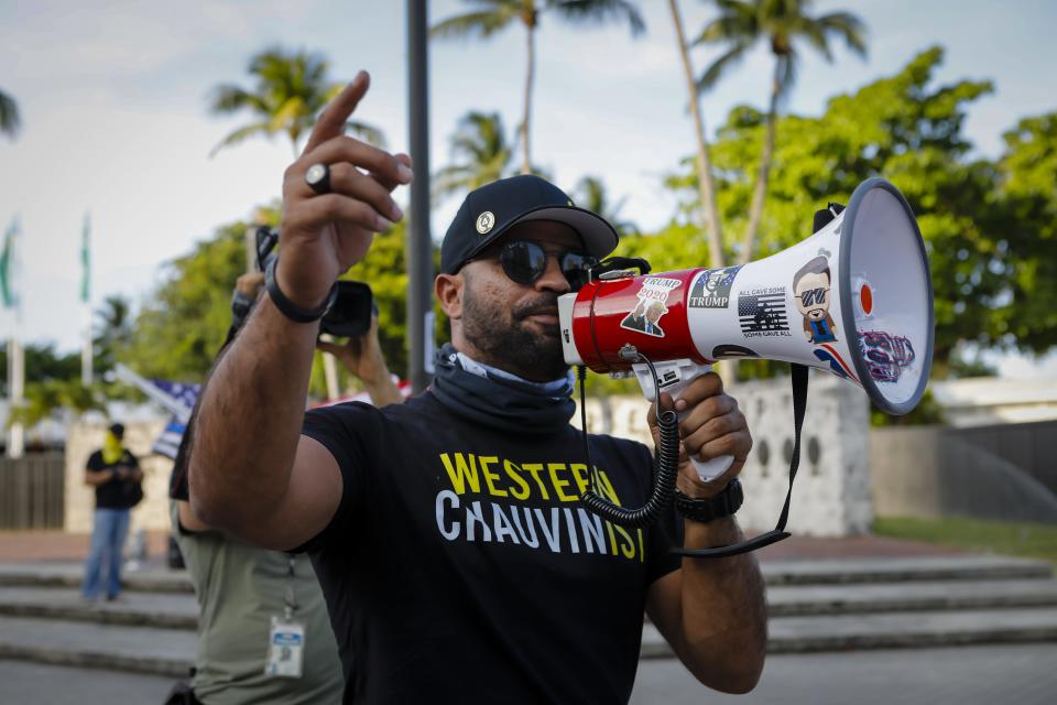 Enrique Tarrio, former leader of the Proud Boys, speaks to Black Lives Matters supporters during a commemoration of the death of George Floyd in Miami on May 25, 2021.