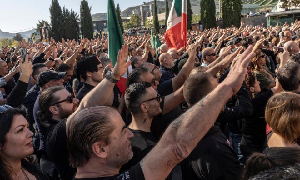 Fascist sympathisers outside the cemetery of San Cassiano in Predappio, where Benito Mussolini is buried.