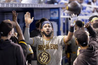 San Diego Padres' Fernando Tatis Jr. celebrates after hitting a solo home run during the first inning of a baseball game against the Miami Marlins, Saturday, July 24, 2021, in Miami. (AP Photo/Lynne Sladky)