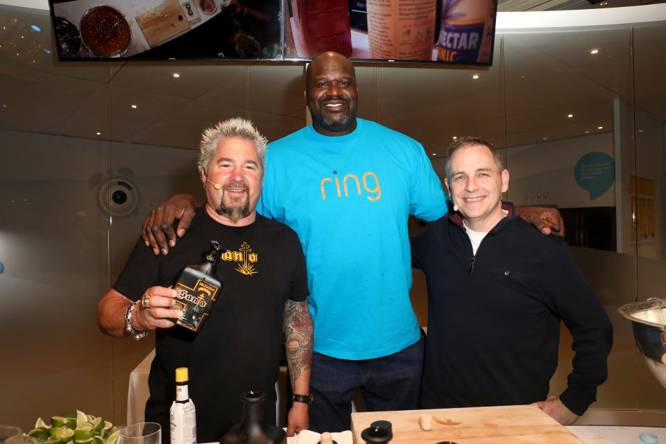 Here he is, hanging out with Shaq and Guy Fieri for reasons passing understanding.