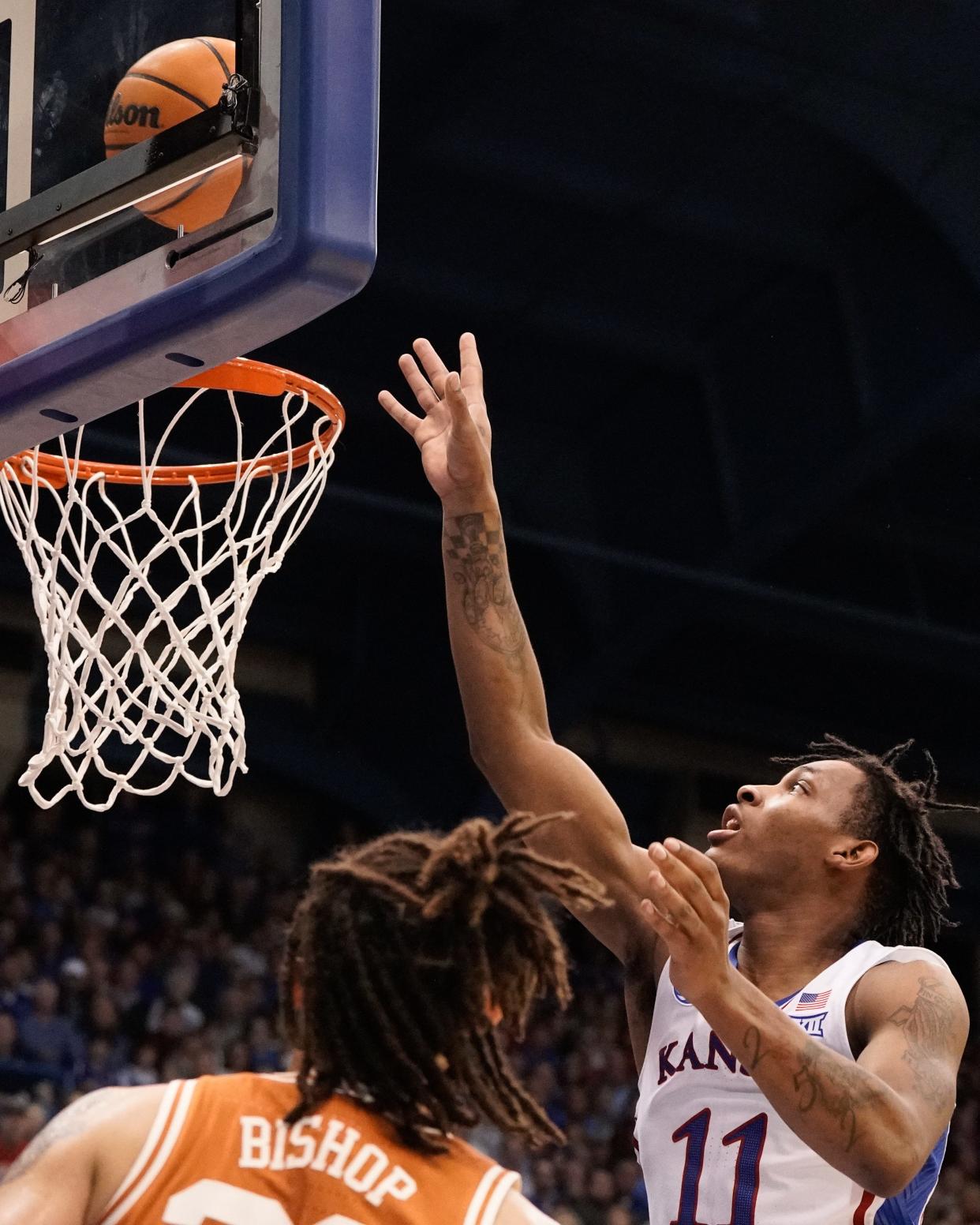 Freshman guard MJ Rice (11) lays in for two for Kansas against Texas during a game during the 2022-23 season inside Allen Fieldhouse.