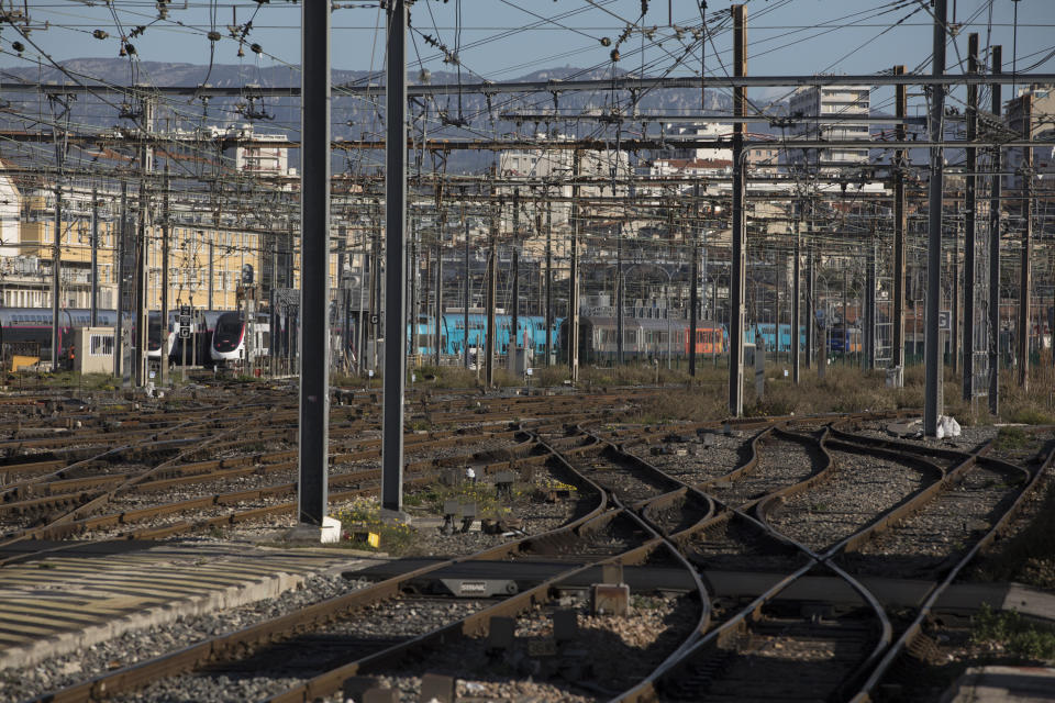 Empty rail tracks at the Gare St-Charles station in Marseille, southern France, Monday, Dec. 9, 2019. Paris commuters inched to work Monday through exceptional traffic jams, as strikes to preserve retirement rights halted trains and subways for a fifth straight day. (AP Photo/Daniel Cole)