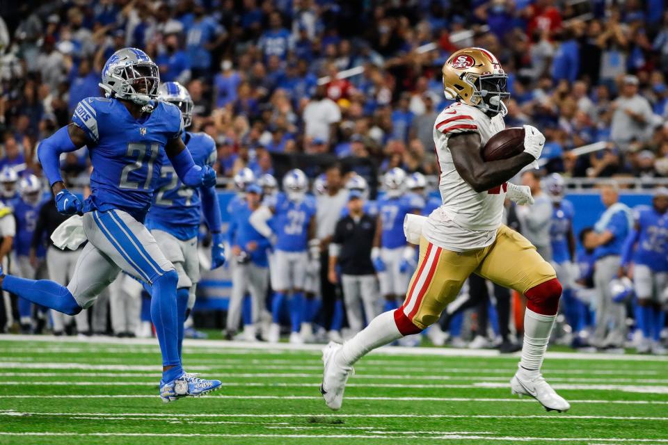San Francisco 49ers wide receiver Deebo Samuel runs for a touchdown against the Detroit Lions during the second half at Ford Field in Detroit on Sunday, Sept. 12, 2021.