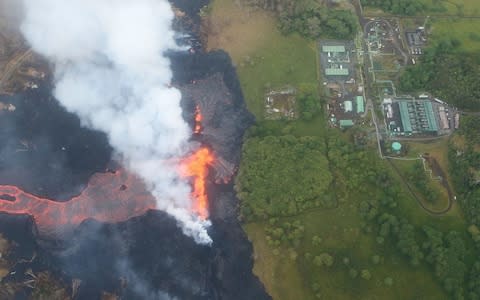 va erupts and flows from a Kilauea volcano fissure, near to the Puna Geothermal Venture (PGV) plant - Credit:  Mario Tama/Getty