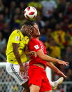 <p>Colombia’s Jefferson Lerma (L) and England’s Jordan Henderson head the ball in their 2018 FIFA World Cup Round of 16 match at Spartak Stadium. Mikhail Tereshchenko/TASS (Photo by Mikhail Tereshchenko\TASS via Getty Images) </p>