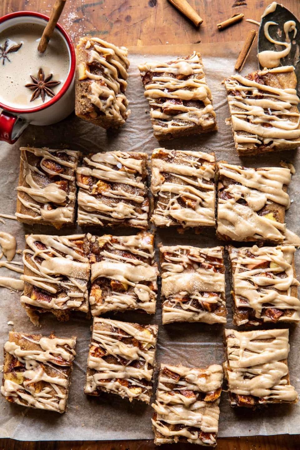 several apple blondies on a sheet of parchment