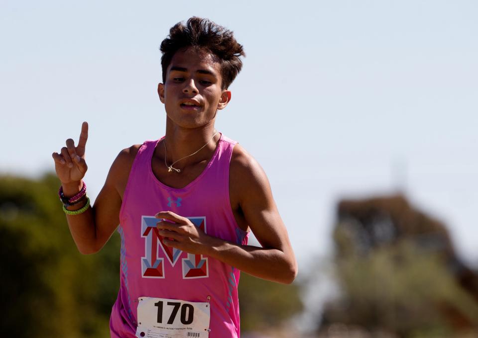 Monterey's David Mora gestures after finishing the 5K run at the District 4-5A cross country meet, Thursday, Oct. 13, 2022, at Mae Simmons Park. Mora placed first in 15 minutes, 41.36 seconds.