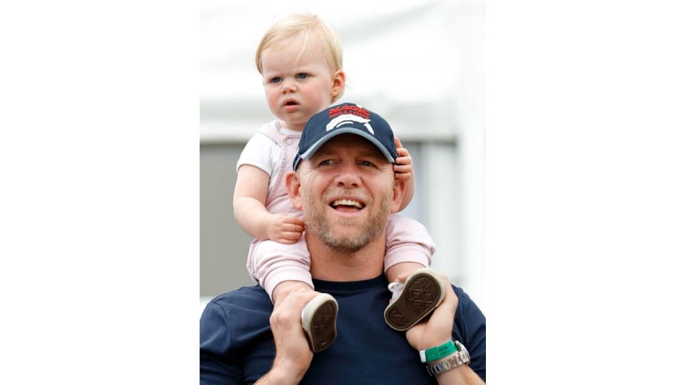 Mike Tindall carries daughter Lena Tindall