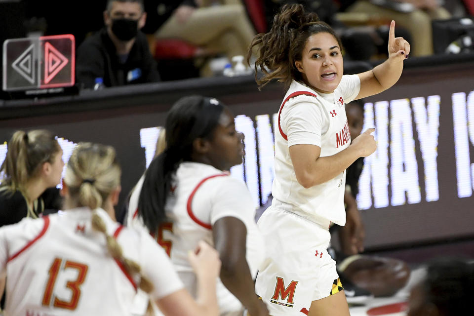 Maryland guard Katie Benzan (11) celebrates after a play against the Purdue during the second half of an NCAA college basketball game, Sunday, Jan. 10, 2021, in College Park, Md. (AP Photo/Will Newton)