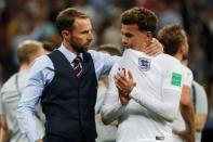 Soccer Football - World Cup - Semi Final - Croatia v England - Luzhniki Stadium, Moscow, Russia - July 11, 2018 England manager Gareth Southgate consoles Dele Alli after the match REUTERS/Grigory Dukor