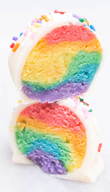 <p>Rainbow colored cake swirled together then dipped in white chocolate and topped with sprinkles to make adorable cake truffles.</p><p><strong>Get the recipe: <a href="https://cookingwithjanica.com/rainbow-cake-truffles-recipe/" rel="nofollow noopener" target="_blank" data-ylk="slk:Rainbow Cake Truffles;elm:context_link;itc:0;sec:content-canvas" class="link rapid-noclick-resp"><em>Rainbow Cake Truffles</em></a></strong></p>