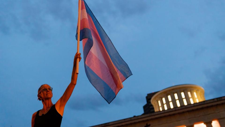 PHOTO: In this file photo from June 24, 2021, Cole Ramsey holds a Transgender Pride Flag in front of the Ohio Statehouse in Columbus, Ohio. (Stephen Zenner/SOPA Images/LightRocket via Getty Images, FILE)