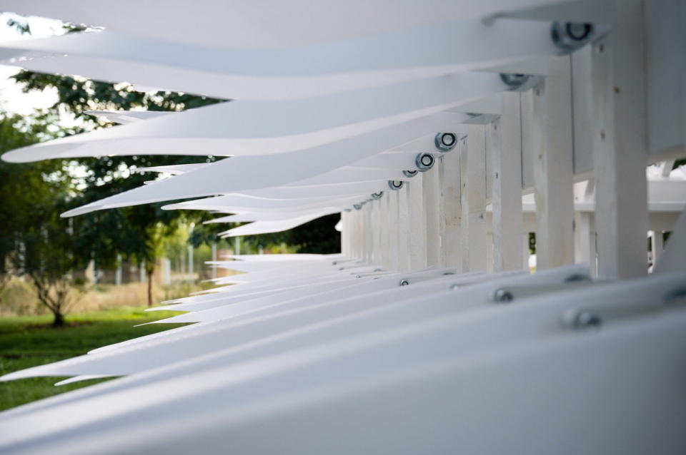 Close-up view of the white shingles that make up the Shiver House kinetic structure in the Louvre-Lens park.