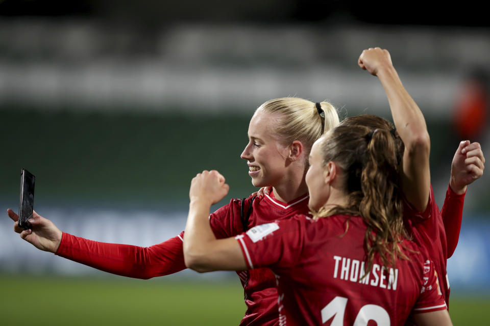 Denmark's Amalie Vangsgaard, left, takes a selfie with her teammates at the end of the Women's World Cup Group D soccer match between Denmark and China at Perth Rectangular Stadium, in Perth, Australia, Saturday, July 22, 2023. Vangsgaard scored the goal in Denmark's 1-0 win, (AP Photo/Gary Day)