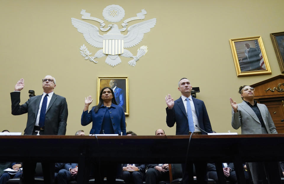 From left, James Baker, Former Deputy General Counsel of Twitter, Vijaya Gadde, Former Chief Legal Officer of Twitter, Yoel Roth, Former Global Head of Trust & Safety of Twitter, and former Twitter employee Anika Collier Navaroli, are sworn in to testify during a House Committee on Oversight and Accountability hearing on Capitol Hill, Wednesday, Feb. 8, 2023, in Washington. (AP Photo/Carolyn Kaster)