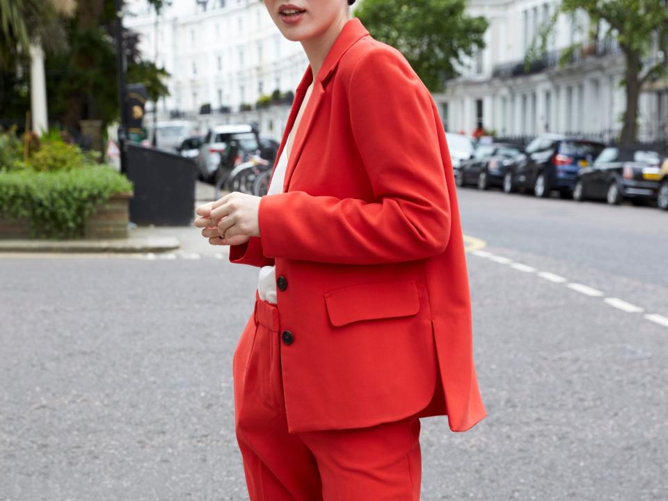 Woman in a red suit.