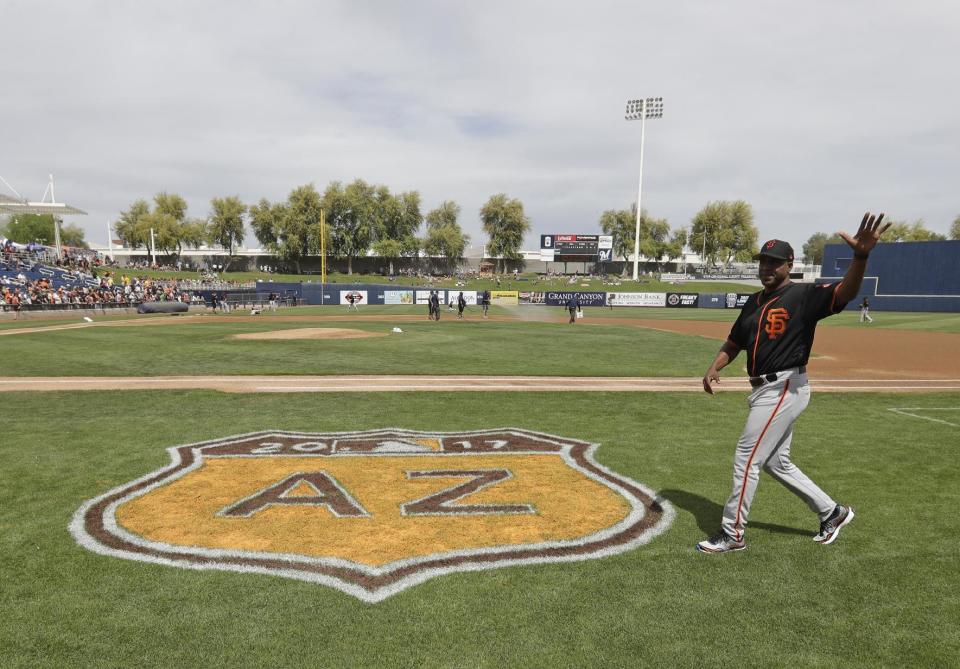 San Francisco Giants' Barry Bonds waves to fans before a spring training baseball game against the Milwaukee Brewers, Wednesday, March 22, 2017, in Phoenix. (AP Photo/Darron Cummings)
