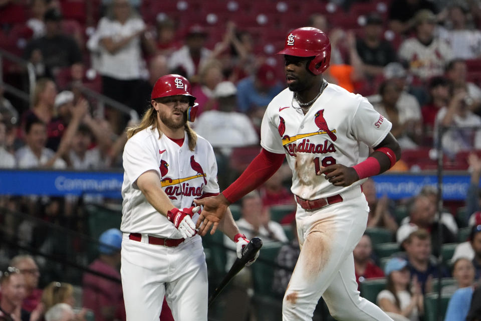 St. Louis Cardinals' Jordan Walker, right, is congratulated by teammate Taylor Motter after scoring during the fourth inning of a baseball game against the Oakland Athletics Tuesday, Aug. 15, 2023, in St. Louis. (AP Photo/Jeff Roberson)