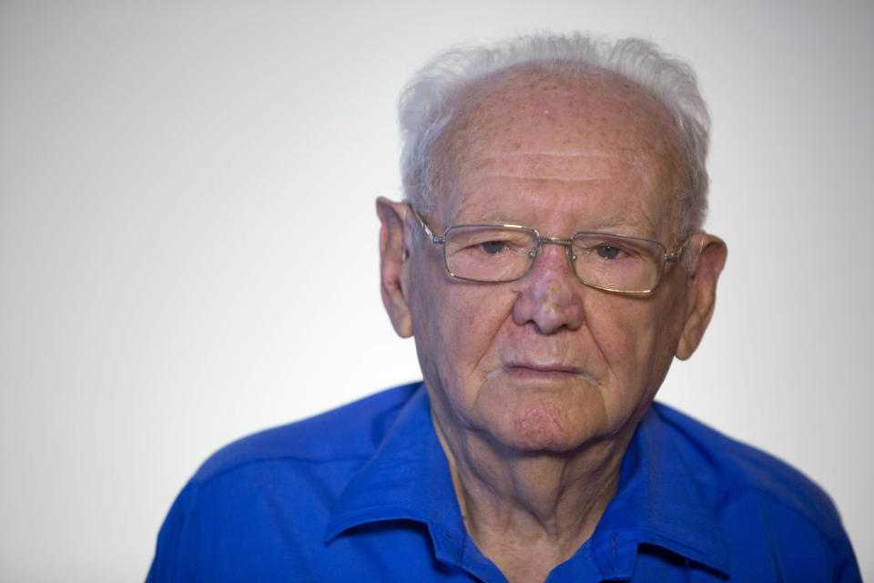 In this photo taken Wednesday, April 9, 2014, Israeli Holocaust survivor Asher Aud (Sieradski), 86, originally from Poland, poses for a portrait in Jerusalem. Aud will be one of the six survivors chosen to light a symbolic torch at Israel’s official ceremony Sunday night marking the remembrance day. (AP Photo/Sebastian Scheiner)