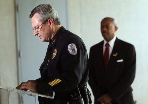 Sanford Police Department Chief Bill Lee (L) speaks while announcing he will temporarily step down in the wake of the Trayvon Martin killing as Sanford city manager Norton Bonaparte Jr. (R) stands by in Sanford, Florida