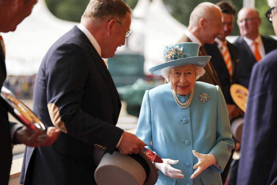 Queen Elizabeth II presents the trophy to the Winning team of the Land Rover International Driving Grand Prix at the Royal Windsor Horse Show, Windsor. Picture date: Sunday July 4, 2021. (Photo by Steve Parsons/PA Images via Getty Images)