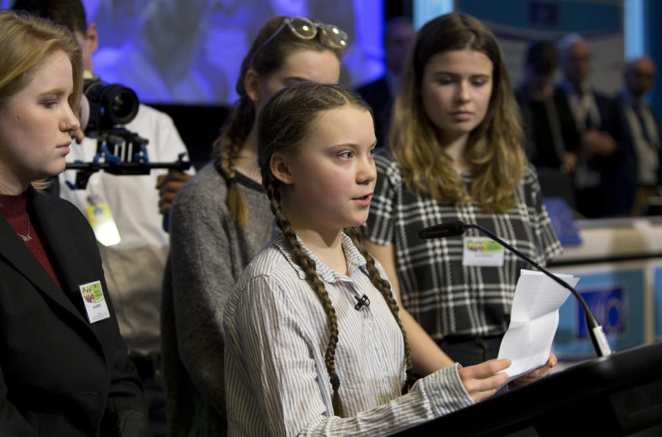 <p>Swedish climate activist Greta Thunberg, center, speaks during an event at the EU Charlemagne building in Brussels, Thursday, Feb. 21, 2019. Thunberg will also participate in a climate march through the city later in the day. (AP Photo/Virginia Mayo) </p>