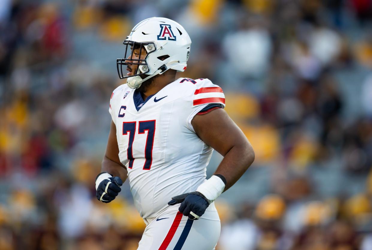 Nov 25, 2023; Tempe, Arizona, USA; Arizona Wildcats offensive lineman Jordan Morgan (77) against the Arizona State Sun Devils during the Territorial Cup at Mountain America Stadium. Mandatory Credit: Mark J. Rebilas-USA TODAY Sports