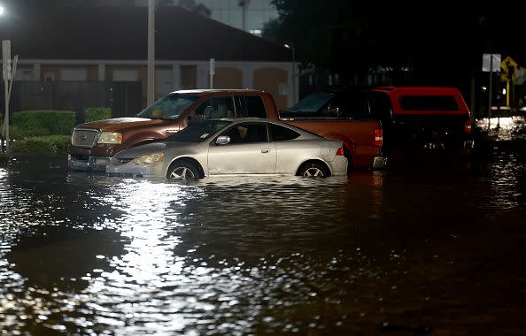 ST PETERSBURG, FLORIDA - AUGUST 30: Vehicles sit in a flooded street caused by Hurricane Idalia passing offshore on August 30, 2023 in St. Petersburg, Florida. Hurricane Idalia is hitting the Big Bend area of Florida. (Photo by Joe Raedle/Getty Images)