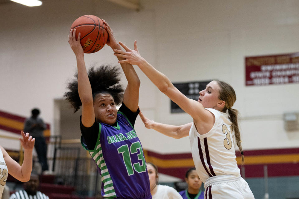 Grace James' Alicia Mangrum grabs the rebound over Atherton's Tabor Boggs. Mangrum is averaging more than 18 points a game this season.