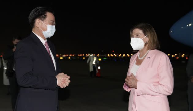 US House Speaker Nancy Pelosi (R) being welcomed by Taiwanese Foreign Minister Joseph Wu (L) after landing at Songshan Airport in August