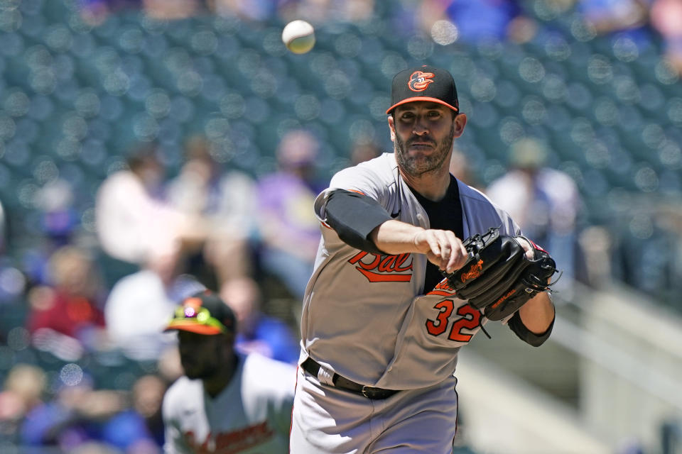 Baltimore Orioles starting pitcher Matt Harvey (32) throws to first to hold New York Mets runner Francisco Lindor on base during the third inning of a baseball game, Wednesday, May 12, 2021, in New York. (AP Photo/Kathy Willens)