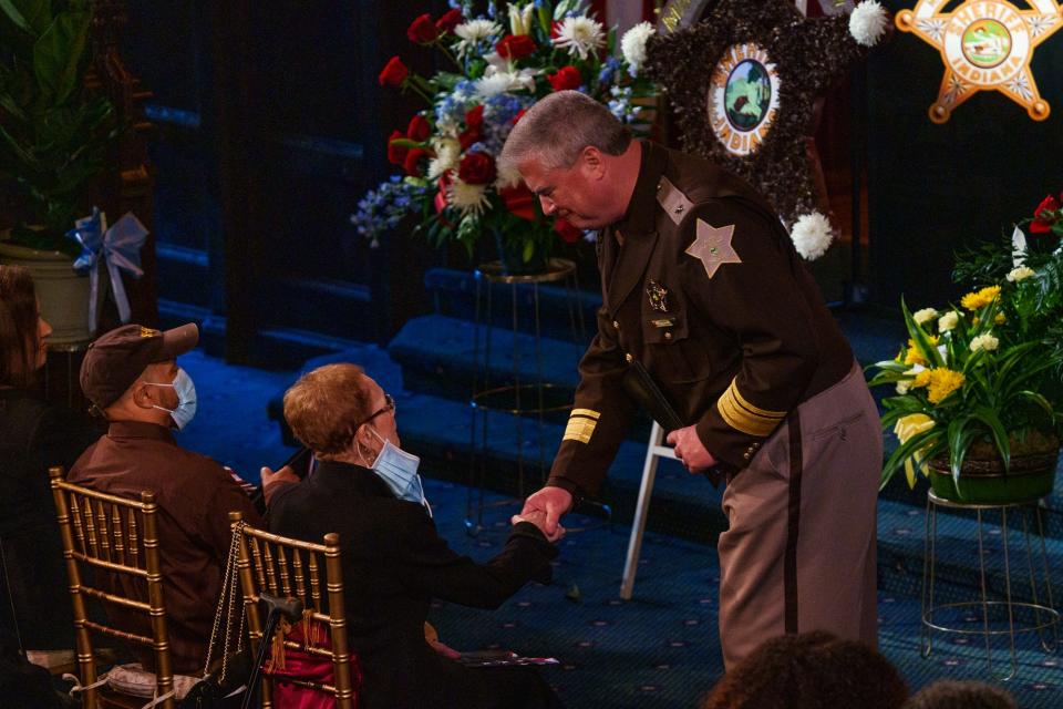 Marion County Sheriff Kerry Forestal embraces Mercedes Anderson, wife of Frank J. Anderson, during a celebration of life in Anderson honor Wednesday, May 11, 2022. Forestal spoke to those in attendance and shared stories of Anderson's life.