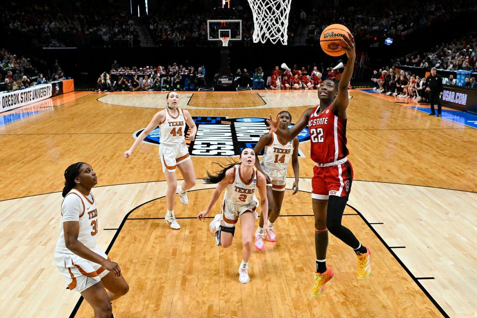 NC State Wolfpack guard Saniya Rivers scores against Texas during their Elite Eight game.