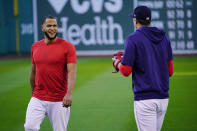 Boston Red Sox Game 3 starting pitcher Eduardo Rodríguez chats with teammate Nick Pivetta at a baseball practice at Fenway Park, Sunday, Oct. 17, 2021, in Boston. The Red Sox host the Houston Astros on Monday night. (AP Photo/Robert F. Bukaty)