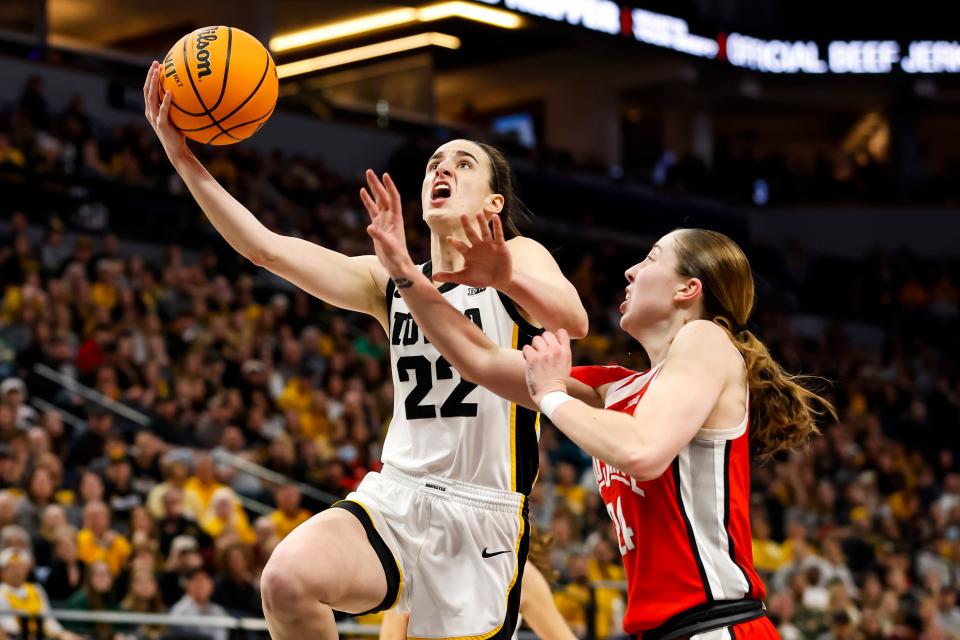 Iowa's Caitlin Clark is fouled by Ohio State's Taylor Mikesell during the championship game of the Big Ten Women's Basketball Tournament on March 5, 2023, in Minneapolis, Minnesota.