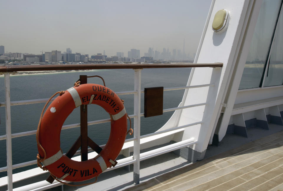 The skyline of Dubai is seen from the rear deck of the Queen Elizabeth 2 as Istithmar World, the Dubai state investment company that owns the ship, outlined plans Monday to turn the retired cruise liner into a 300-room hotel, ending years of speculation about its fate, in Port Rashid, Dubai, United Arab Emirates, Monday, July 2, 2012. Britain's Queen Elizabeth II launched the QE2 in 1967. (AP Photo/Kamran Jebreili)