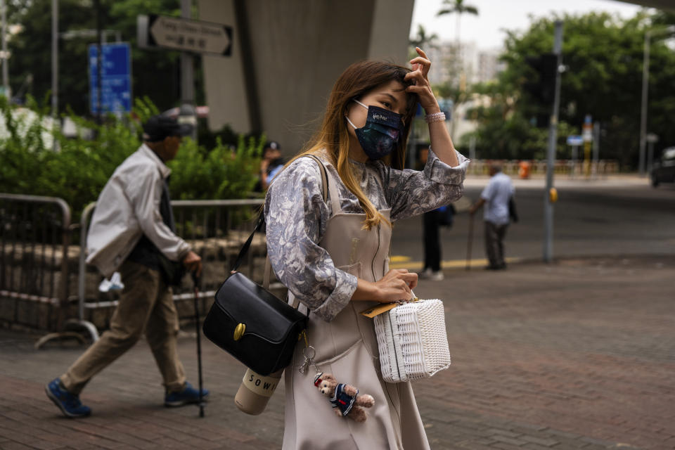 Pro-democracy activist Clarisse Yeung Suet-ying arrives at the West Kowloon courts as closing arguments open in Hong Kong's largest national security trial of 47 pro-democracy figures in Hong Kong, Wednesday, Nov. 29, 2023. (AP Photo/Louise Delmotte)