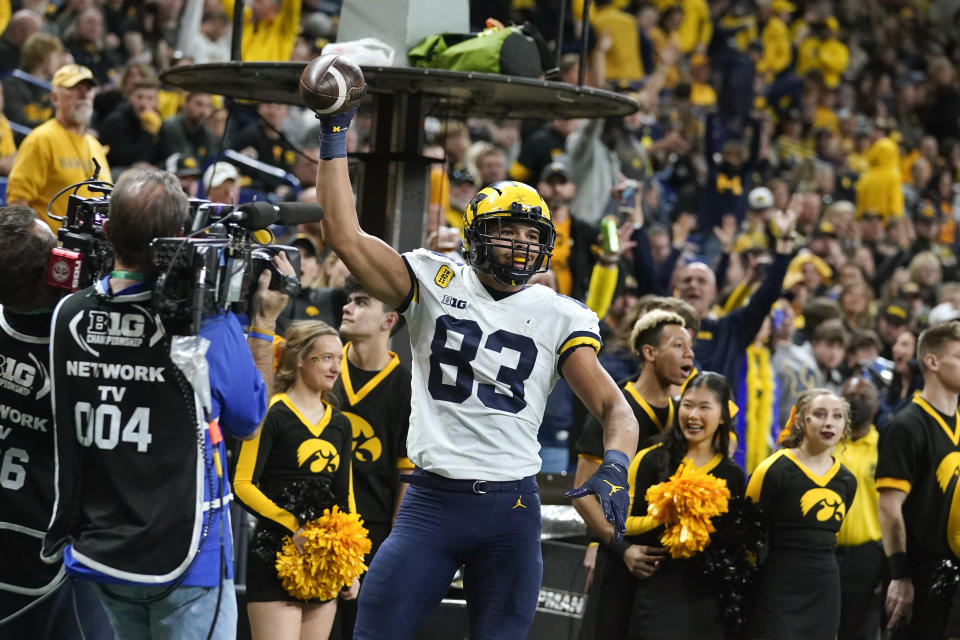 Michigan tight end Erick All (83) celebrates after catching a 5-yard touchdown pass during the second half of the Big Ten championship NCAA college football game against Iowa, Saturday, Dec. 4, 2021, in Indianapolis. (AP Photo/Darron Cummings)