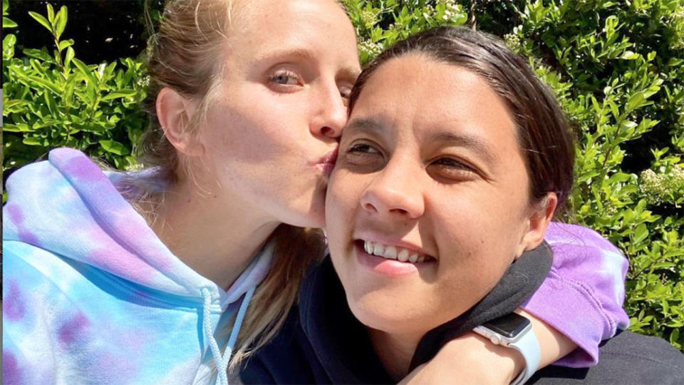 Pictured here, Nikki Stanton plants a kiss on Sam Kerr's cheek.