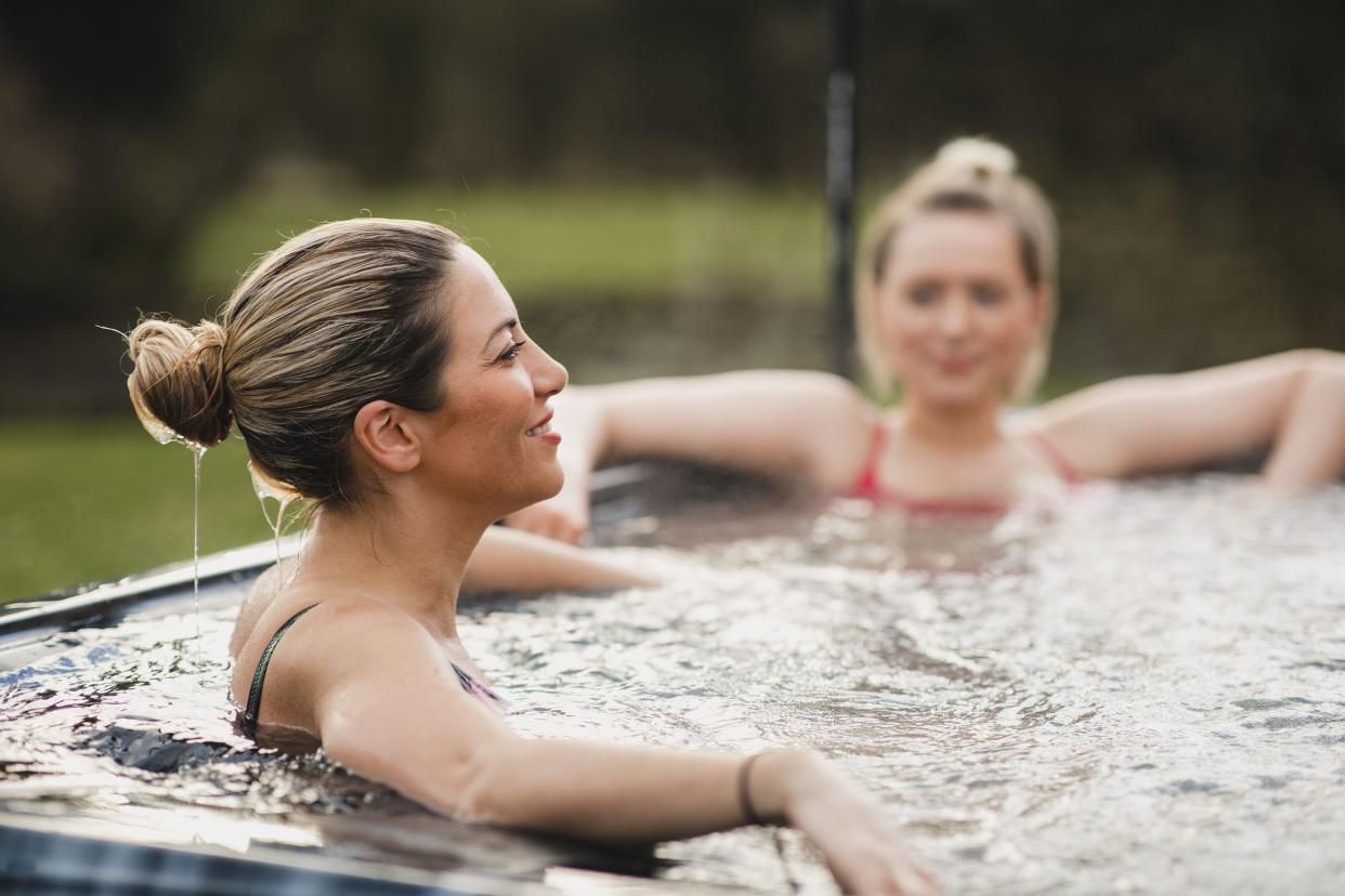 two women relaxing in hot tub