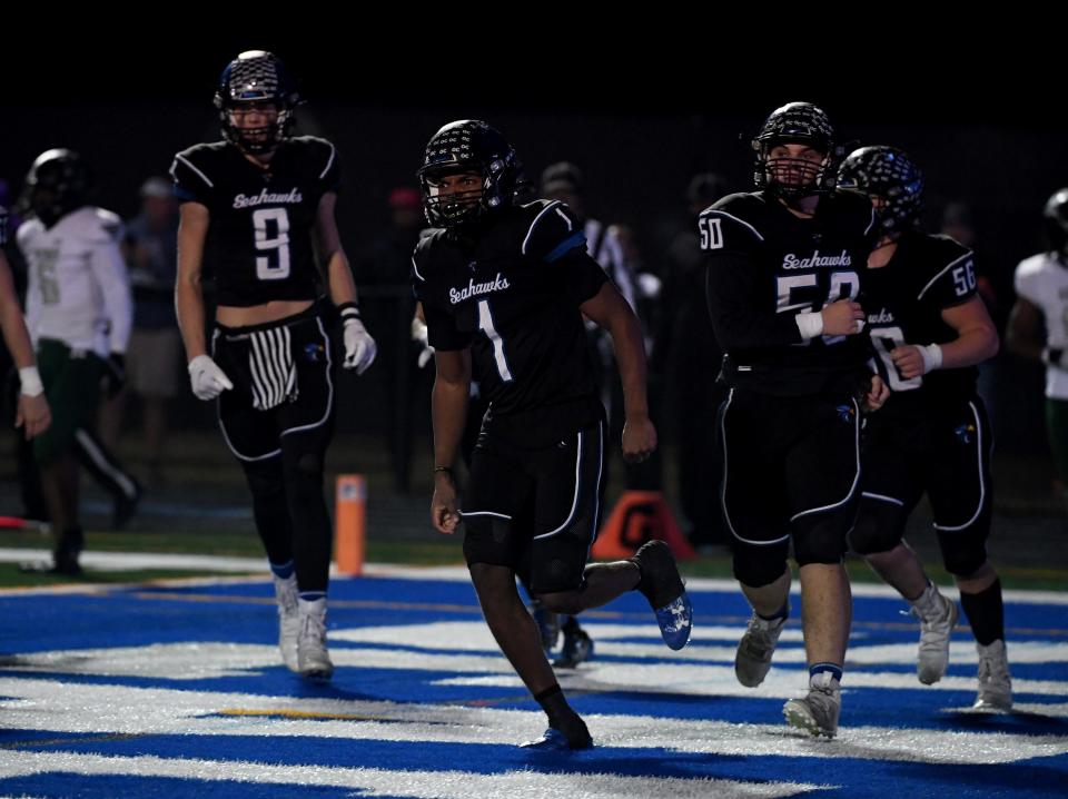 Decatur's Careen Bolden (1) celebrates his touchdown against Milford Mill Friday, Nov. 24, 2023, in the 2A State Semifinal in Berlin, Maryland. Decatur defeated Milford Mill 35-34.